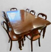 A Victorian style mahogany extending dining table, the top with double moulded edge above a