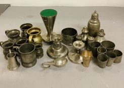 A selection of various pewter items to include, egg cups, salt and pepper pots, napkin rings, etc