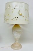 A white marble table lamp with shade