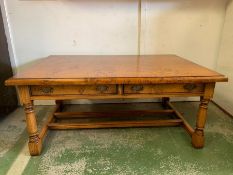 A Stewart Linford coffee table on turned legs and drawers to centre (H52cm W115cm D77cm)