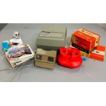 A selection of View Master, viewers, discs and a classic projector.