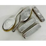 A selection of five silver backed dressing table brushes, hallmarked.