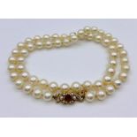 A Pearl necklace with seed pearl and 9ct gold clasp