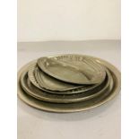 A small selection of various size pewter trays