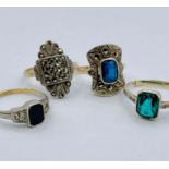A Selection of four various rings marked 9ct gold and Silver.