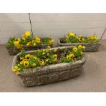 Three long cast stone/concrete planters