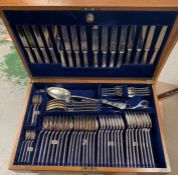 An oak veneered Mappin plate canteen of cutlery, eight place setting by Mappin and Webb Ltd