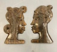 Two carved African head wall plaques