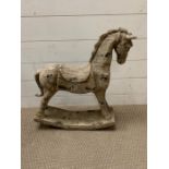 A wooden rocking horse (58cm x 50cm)