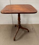 A mahogany tilt top side table on tripod feet (H74cm W60cm D54cm)