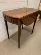 A Mahogany drop leaf table with a single drawer