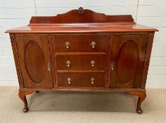 A Mahogany sideboard consisting of three centred drawers, flanked by a cupboard wither side (H 112cm