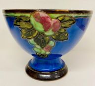 A Royal Doulton stoneware glazed tubeline bowl c1933, embossed fruit decoration on cobalt blue