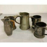 A selection of five pewter jugs
