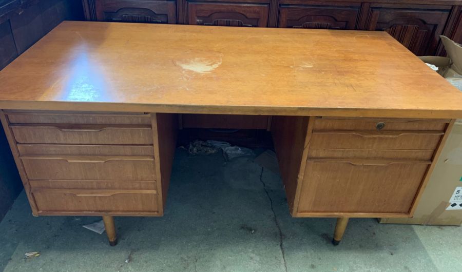 A teak Mid Century office desk (H75cm W152cm D76cm)