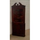 A mahogany corner cabinet (H192cm W82cm D57cm)