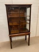 A glazed cabinet on stand with inlay (H160cm W82cm D44cm)