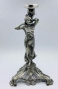 An Art Nouveau style candlestick of a lady signed to base.