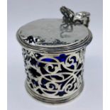 A silver pierced mustard with blue glass liner. H A & Sons, hallmarked for London 1872.