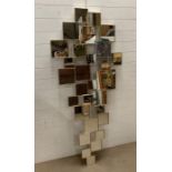 A contemporary small square abstract style mirror with brackets (H185cm W82cm)