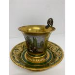 A Sevres Cup and Saucer 1814-25 The cup is painted with a view of a rustic thatched building and