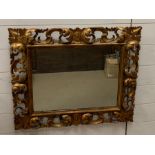 A 17th century style carved and giltwood framed wall mirror (72cm x 63cm)