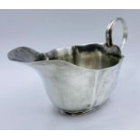A hallmarked silver sauce boat, dated 1874, by Josiah Williams & Co (144g)