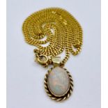 A 9ct gold chain with Opal pendant (Total weight 9g)