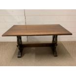 An oak coffee table with peg sides by J.C (H46cm W90cm D46cm)