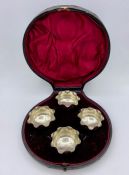 A set of four silver salts with wavy edge on circular bases, approx 2" across, Birmingham 1899