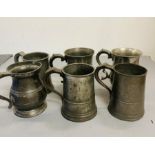 Six pewter Quart tankards