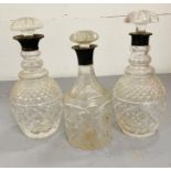 Three silver necked glass decanters.