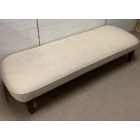 A daybed on mahogany feet (H39cm W187cm D70cm)