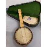 A cased vintage banjo