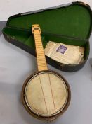 A cased vintage banjo