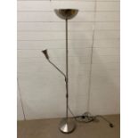 A chrome uplighter with reading lamp