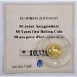 A 0.5g 14ct (585) collectable gold coin 50 Francs CFA Congo