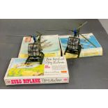 Two Britains helicopters models and three aircraft model kits