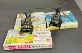 Two Britains helicopters models and three aircraft model kits