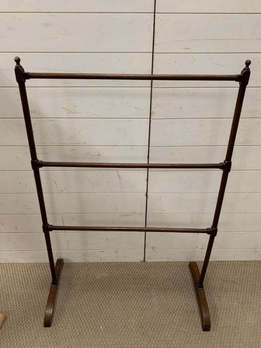 A mahogany towel rail AF