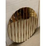 A circular contemporary mirror with a wooden gilt frame base with brackets (Dia98cm)