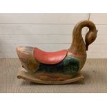 A solid wood carved swan rocking horse (57cm 70cm)