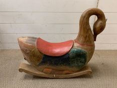 A solid wood carved swan rocking horse (57cm 70cm)