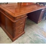 A rosewood pedestal desk with carving to door sides and turned metal handles (186cm x 90 cm x 78