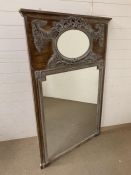 Bleached over mantel mirror with oval mirrored panel surrounded by tied ribbon and floral swags