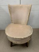 A low bedroom chair on mahogany legs (H76cm W54cm SH38cm)