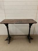 A console table on wrought iron stand base (H78cm W107cm D43cm)