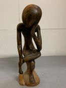 A wooden carving in the style of "The Thinker" (H42cm)