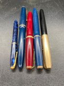 Five various pens, some Parkers