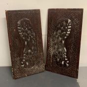 Two carved wooden plaques depicting birds and blossom trees